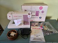 Sewing machine, box, foot pedal, manual, accessory pouch, wicker basket, bag of notions