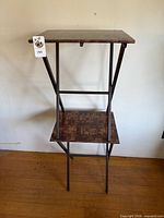 Both folding TV trays shown open, wood veneer tops, metal legs