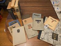 Group shot of all books and booklets on table