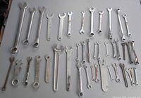 Full layout of 41 mixed wrenches on tabletop