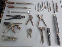 Full layout of the 24 assorted tools on table