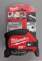 Front of sealed Milwaukee 25 ft rechargeable magnetic tape measure package
