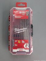 Front of sealed Milwaukee 15-piece Red Helix titanium drill bit set in clear PACKOUT case