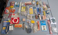 Overhead view of entire lot displaying packaged hardware and loose items on table