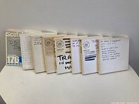Front view showing eight tape boxes with labels