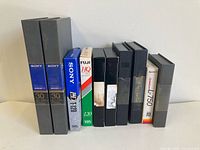 Group shot of all 10 tapes standing upright showing spines and branding