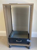 Front view of rack showing rails and drawer