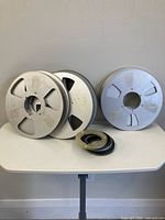 Three 10.5" reels with stack of centre hubs