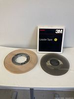 All three items: sealed 3M box, 1⁄2-inch paper leader on pancake, 1⁄4-inch leader on reel