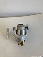 Left side view showing body, spool markings "Stradic 2500FH"