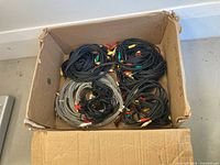 Box containing numerous RCA cables