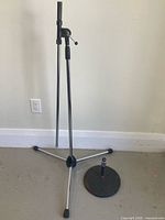 Full view of both microphone stands standing on floor