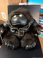 Front view of gorilla plush wearing jacket