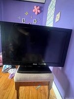 Front view of RCA 32-inch television on stand
