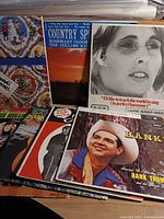 Stack of LP records showing several identifiable titles