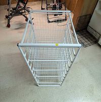 Angled view of 4-tier white wire storage unit showing basket shelves and overall structure