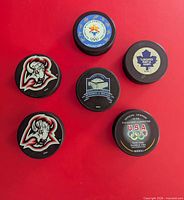 Front graphics of all six pucks displayed