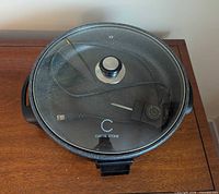 Pan with lid and probe cord shown on top