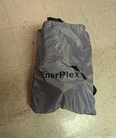 Gray drawstring carry bag labeled EnerPlex