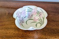 Top view showing floral painting and scalloped rim