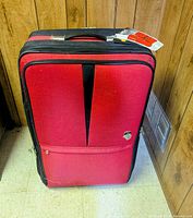 Front view of red and black Heys suitcase