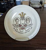 Front view of 10 in Royal Wedding commemorative plate featuring portraits of Prince Charles and Lady Diana, design details