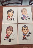 All four caricature prints laid out