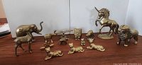 Group shot of all brass animal figurines
