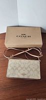 Clutch with strap and Coach box