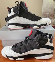 Left lateral and right medial views of both sneakers on original box