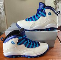 Left lateral view of both shoes on box