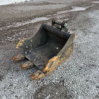 Front angled view showing bucket, teeth, and side wear plates