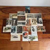 All twenty postcards laid out on wooden surface