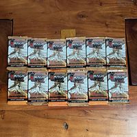 Front view of all 12 sealed Dominaria Remastered draft booster packs
