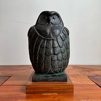 Front view of signed Austin Productions owl on wood base