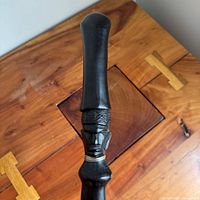 Handle with carved head detail