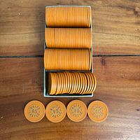 Top view of stacked orange White Castle $5 chips with five chips face up