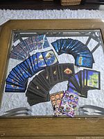 Overview of all trading cards and counters spread on glass table