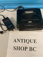 Top view of Sega Genesis Model 2 console with AC adapter