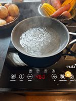 Cooktop in use boiling water showing digital display 460°F