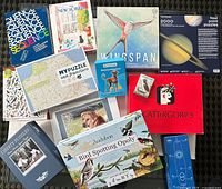 All board games and puzzles laid out showing titles and condition