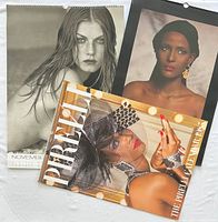 Front covers of three Pirelli calendars showing different years and imagery