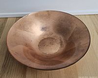 Top view of copper-tone art glass bowl