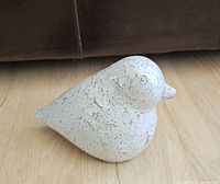 Left-side view of ceramic bird figurine