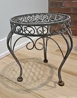 Full view of metal plant stand front and side