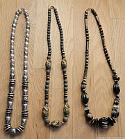 All three necklaces laid out side by side