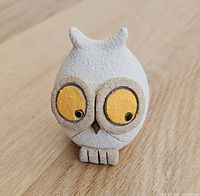 Front angled view of the small ceramic owl figurine