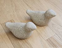Two small crackle-glaze pottery bird figurines top view