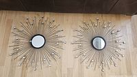 Front view of both starburst mirrors showing design and condition