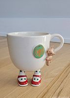 Front view showing shield emblem, legs, shoes